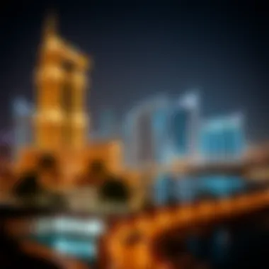 Night view of the Oberoi Centre illuminated against the Dubai skyline